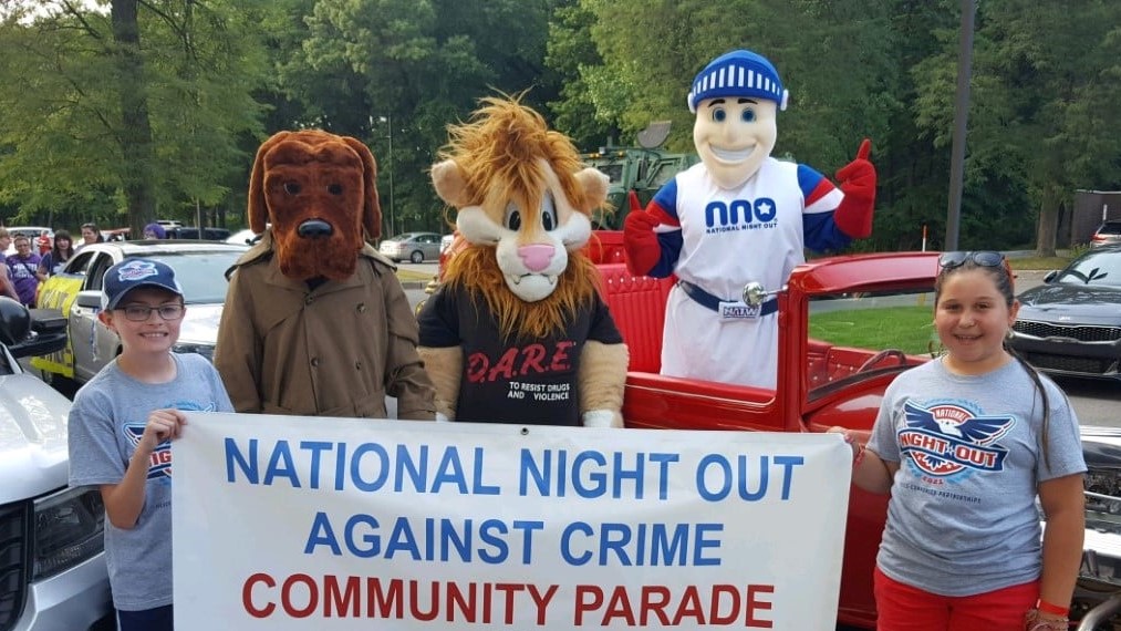 Daren the Lion with McGruff the Crime Dog and Nat the Knight at the Munster National Night Out Event