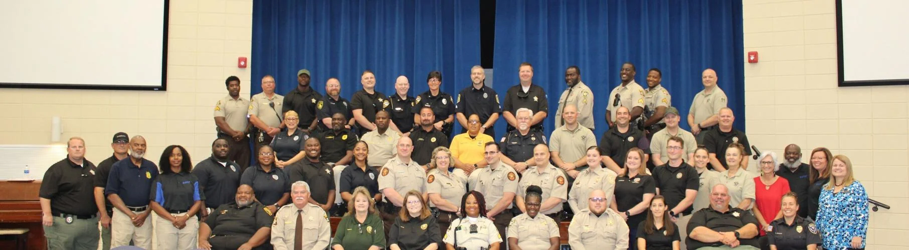 REUNITED AND IT FEELS SO GOOD: The D.A.R.E. resource officers posed for a group photo during their opening ceremony and reception on Monday afternoon.