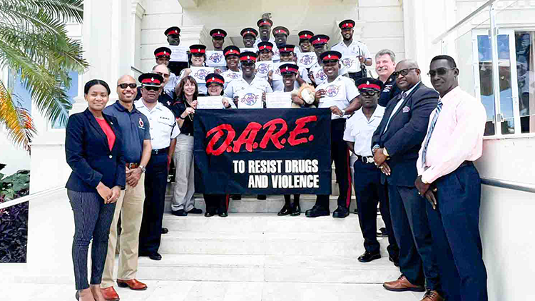 Group photo of the 17 Certified D.A.R.E officers along with the facilitators and senior RTCIPF management.