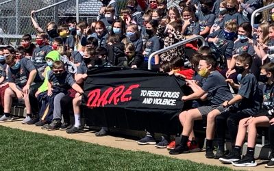 Russell flexes D.A.R.E. Muscle: Fifth-Graders Complete program, Have Ceremony